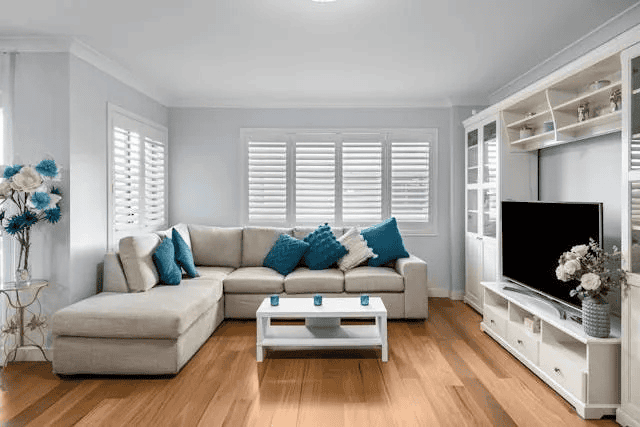 a-blue-and-white-living-room-with-a-large-white-couch
