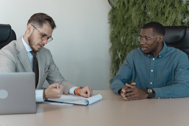two people looking at application form