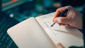 Closeup hand marking checklist