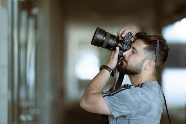 focused photographer taking a photo
